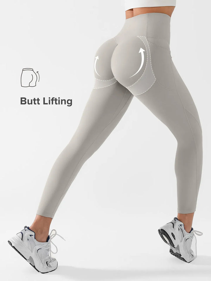 A model wearing a BRXL® Side Pocket Butt-Lift Leggings in