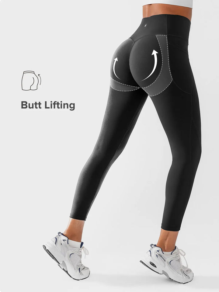 A model wearing a BRXL® Side Pocket Butt-Lift Leggings in