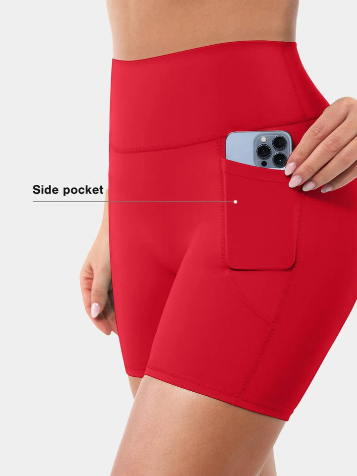 A model wearing a BRXL® Sports Bra Sculpted Shorts Sculpted Leggings Set in