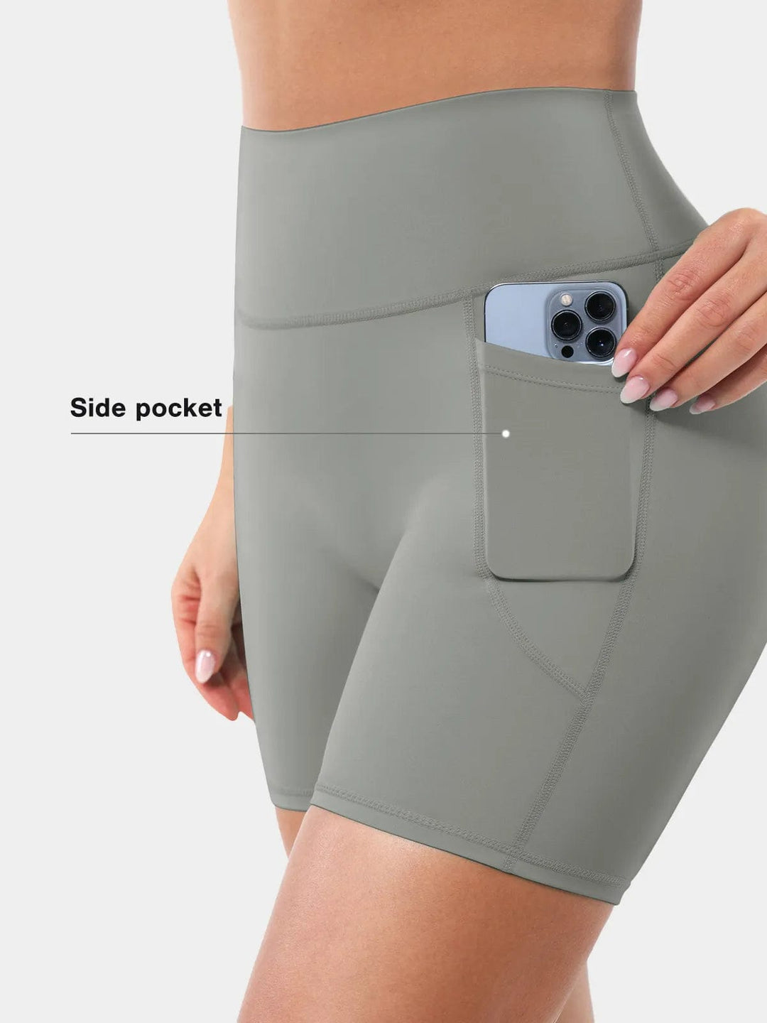 A model wearing a BRXL® Sports Bra Sculpted Shorts Sculpted Leggings Set in