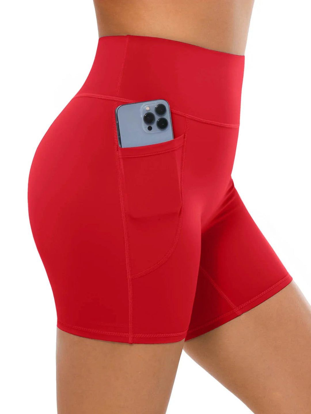 A model wearing a BRXL® Sports Bra Sculpted Shorts Sculpted Leggings Set in Shorts / Red / XS