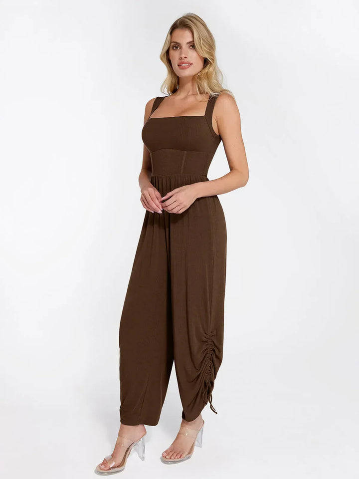 Brown square neck shapewear jumpsuit with adjustable ruched wide legs and tummy control.