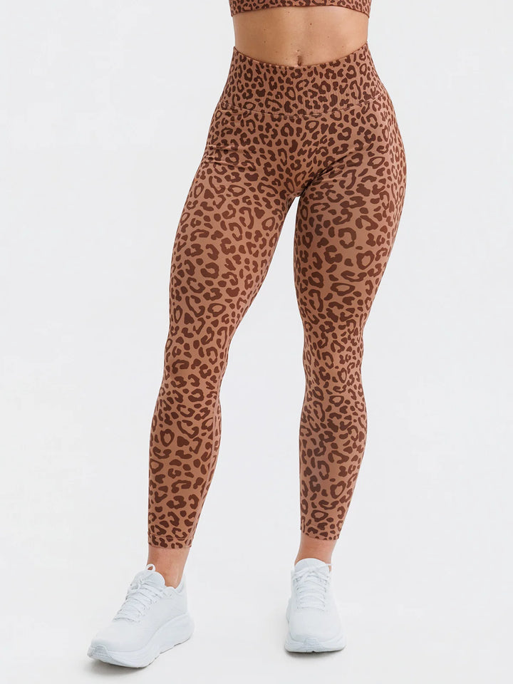 A model wearing a BRXL® STAYLAT™  Seamless Pro 3.0 High-Rise Sculpt Anti-Roll Leggings