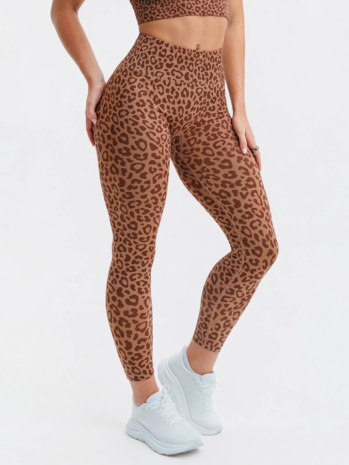 A model wearing a BRXL® STAYLAT™  Seamless Pro 3.0 High-Rise Sculpt Anti-Roll Leggings Leopard / XS