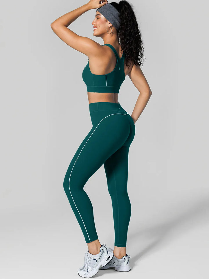 A model wearing a BRXL® Tummy Control High Rise Yoga Leggings in