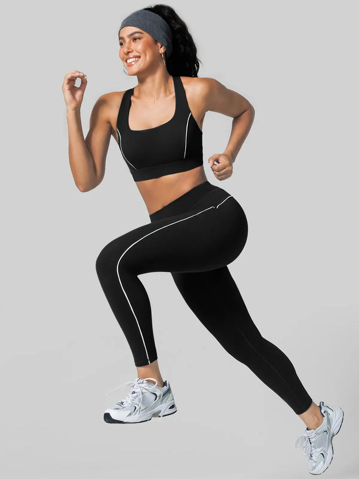 A model wearing a BRXL® Tummy Control High Rise Yoga Leggings in