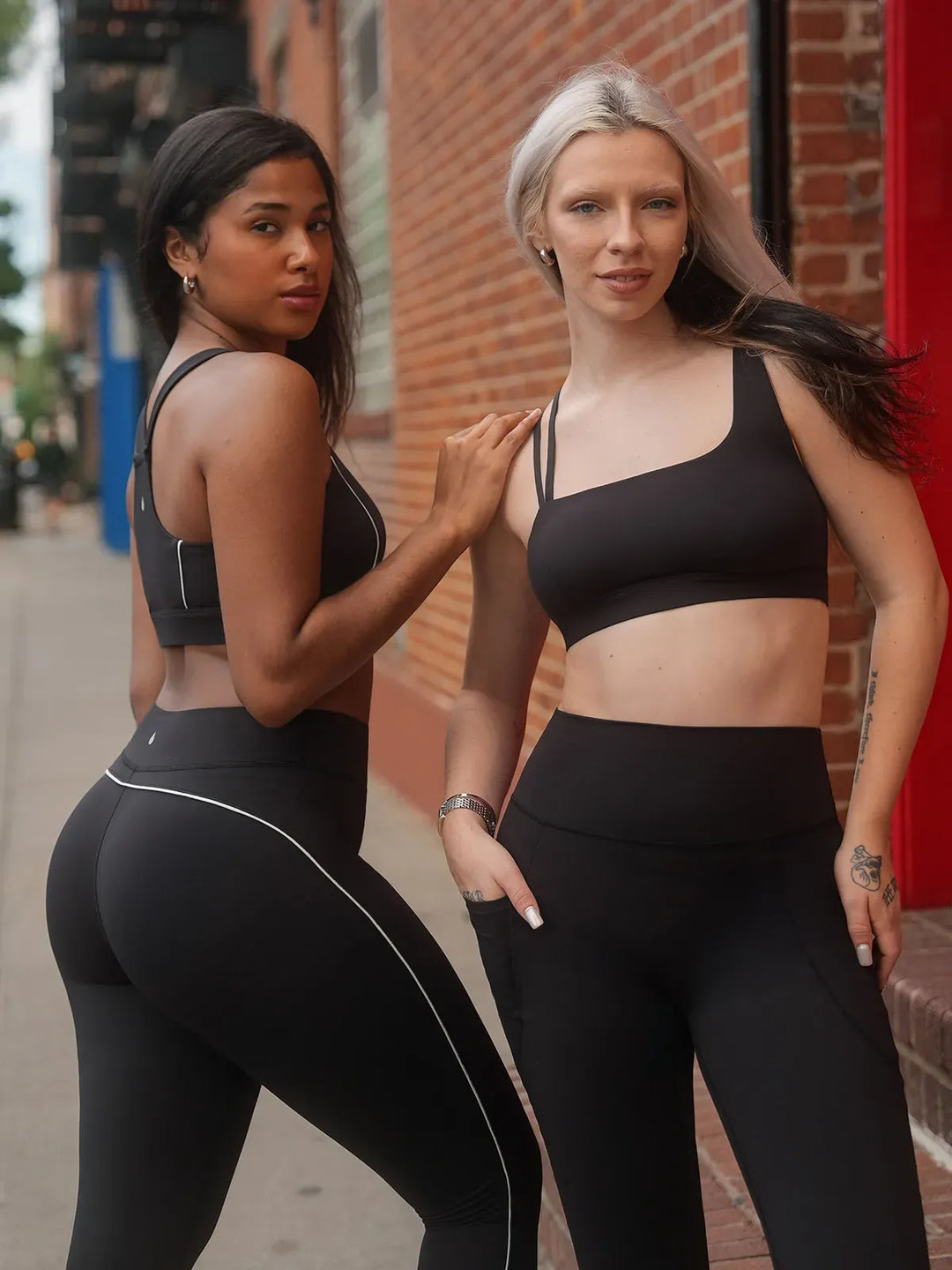 A model wearing a BRXL® Tummy Control High Rise Yoga Leggings in