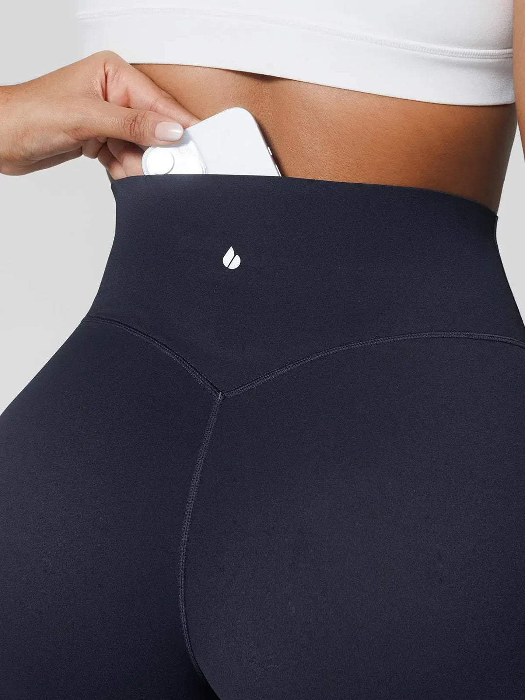 A model wearing a BRXL® Tummy Control Wide Leg Activewear Leggings in