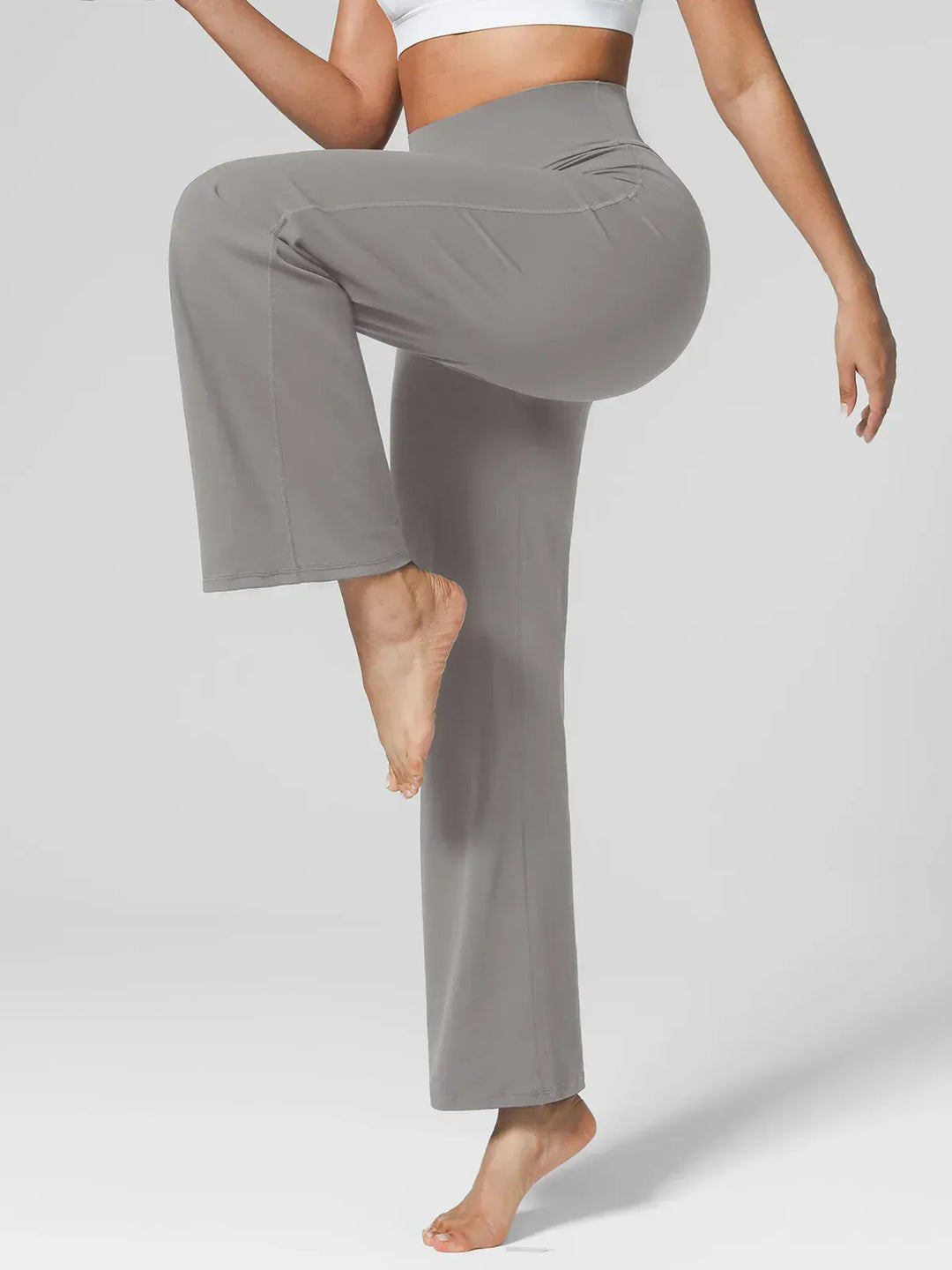 A model wearing a BRXL® Tummy Control Wide Leg Activewear Leggings in