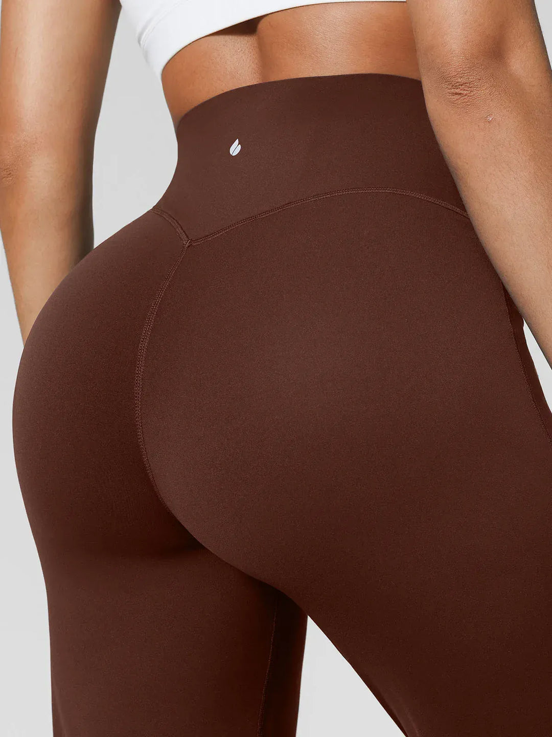 A model wearing a BRXL® Tummy Control Wide Leg Activewear Leggings in