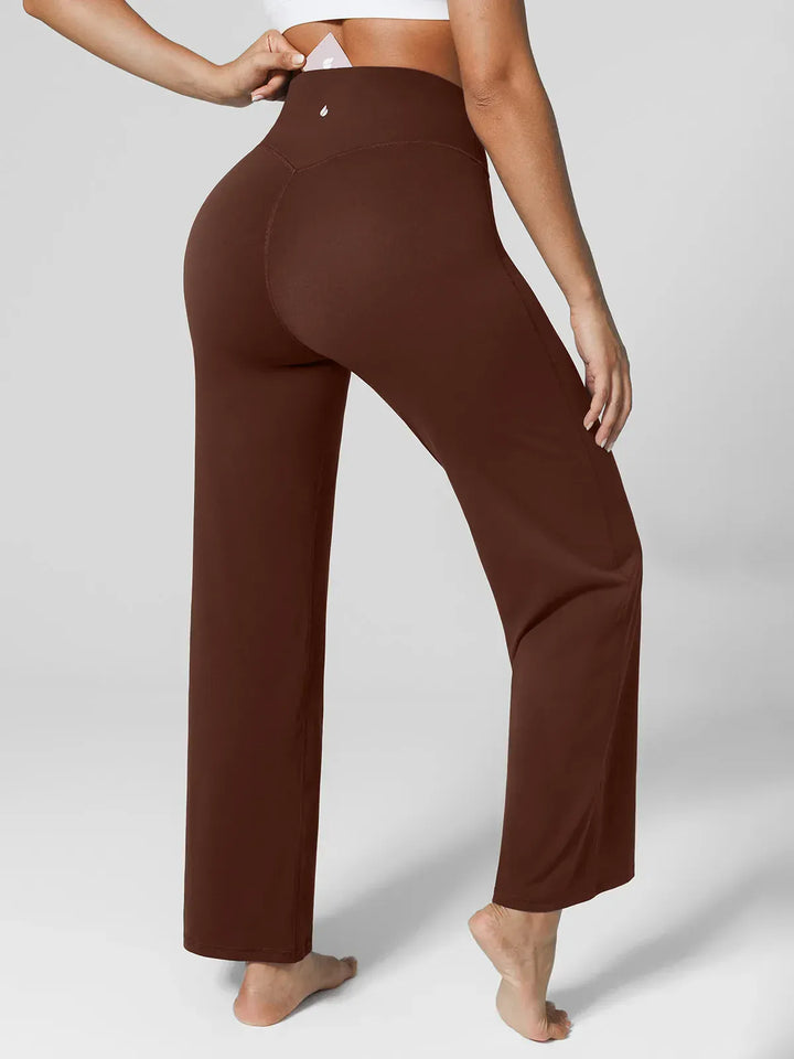 A model wearing a BRXL® Tummy Control Wide Leg Activewear Leggings in