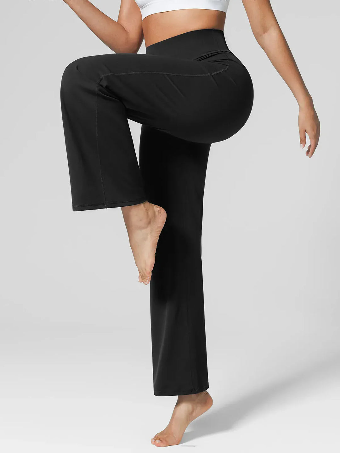 A model wearing a BRXL® Tummy Control Wide Leg Activewear Leggings in