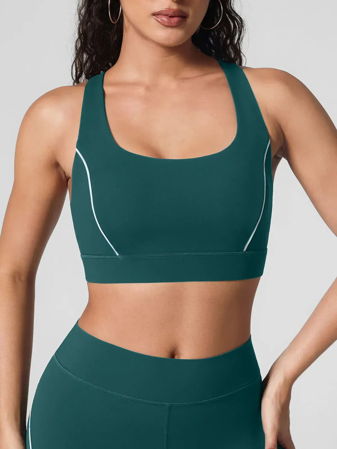 A model wearing a BRXL® Wide Strap Yoga-Friendly Sports Bra