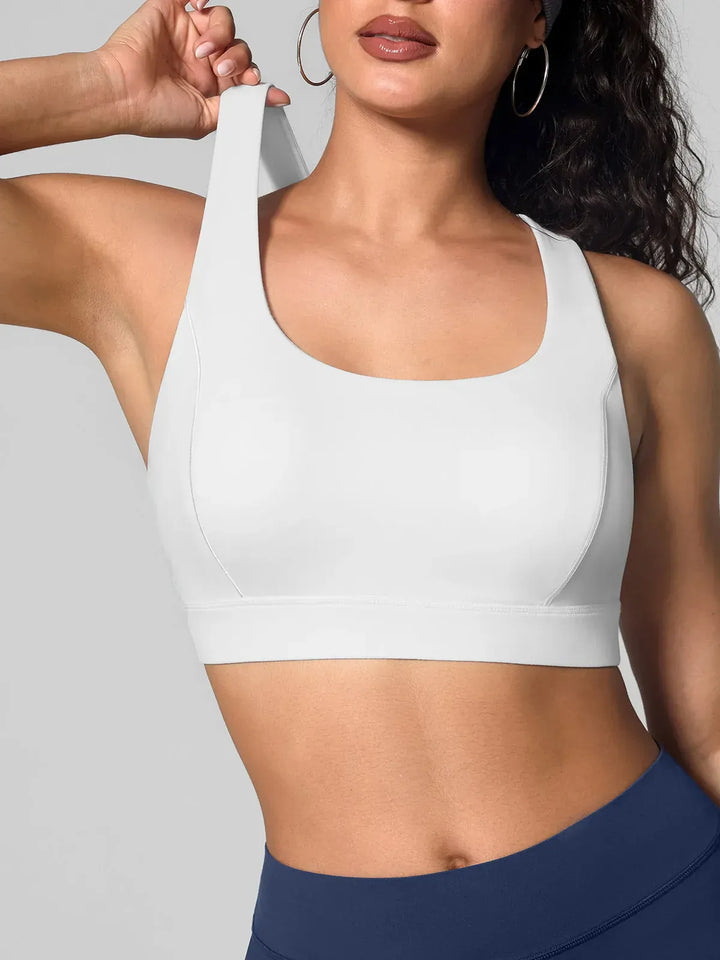 A model wearing a BRXL® Wide Strap Yoga-Friendly Sports Bra
