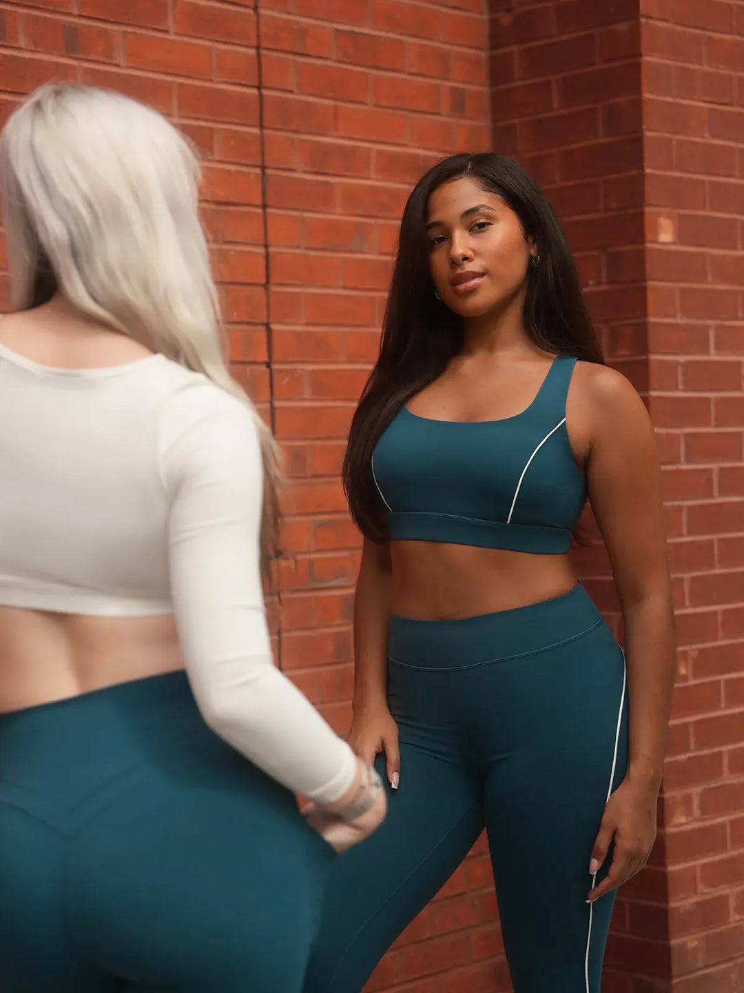 A model wearing a BRXL® Wide Strap Yoga-Friendly Sports Bra in