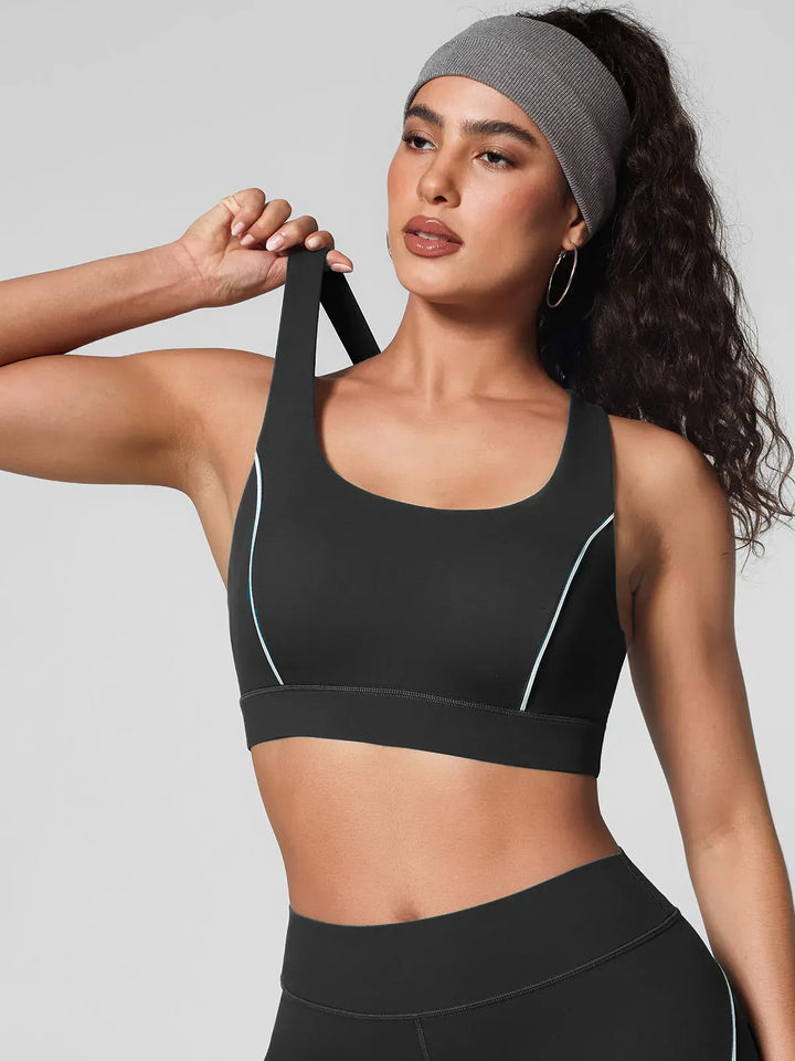 A model wearing a BRXL® Wide Strap Yoga-Friendly Sports Bra Black / XS