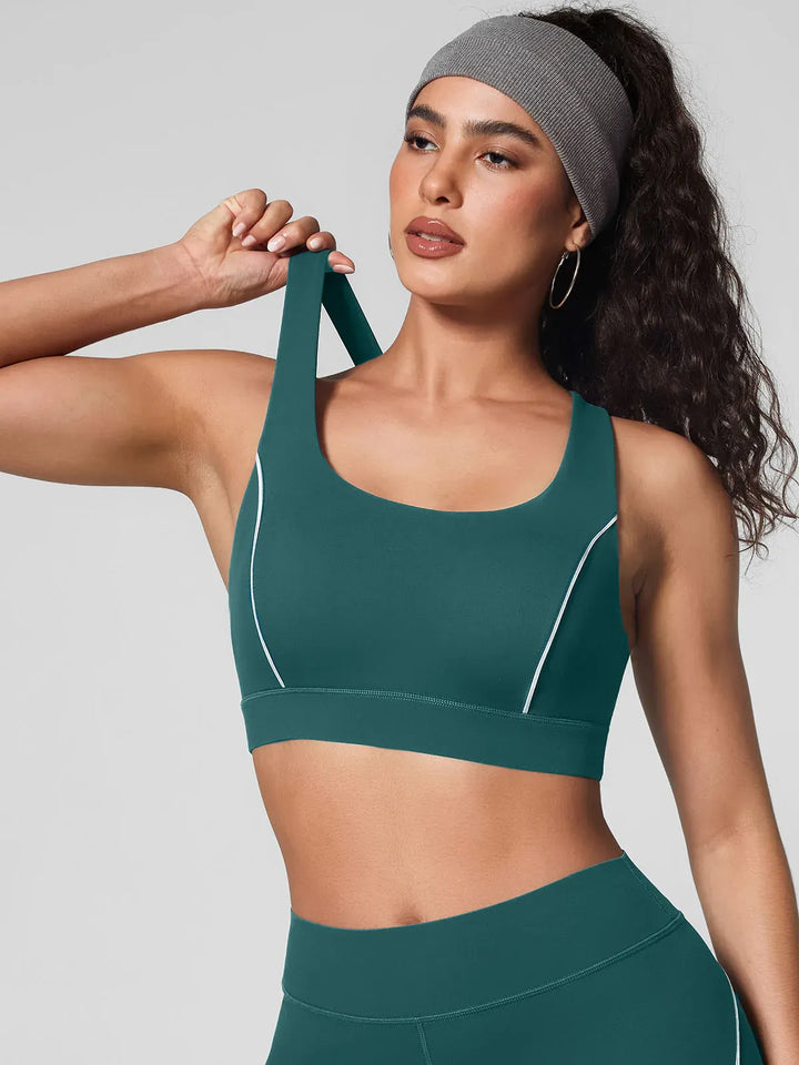 A model wearing a BRXL® Wide Strap Yoga-Friendly Sports Bra Green / XS